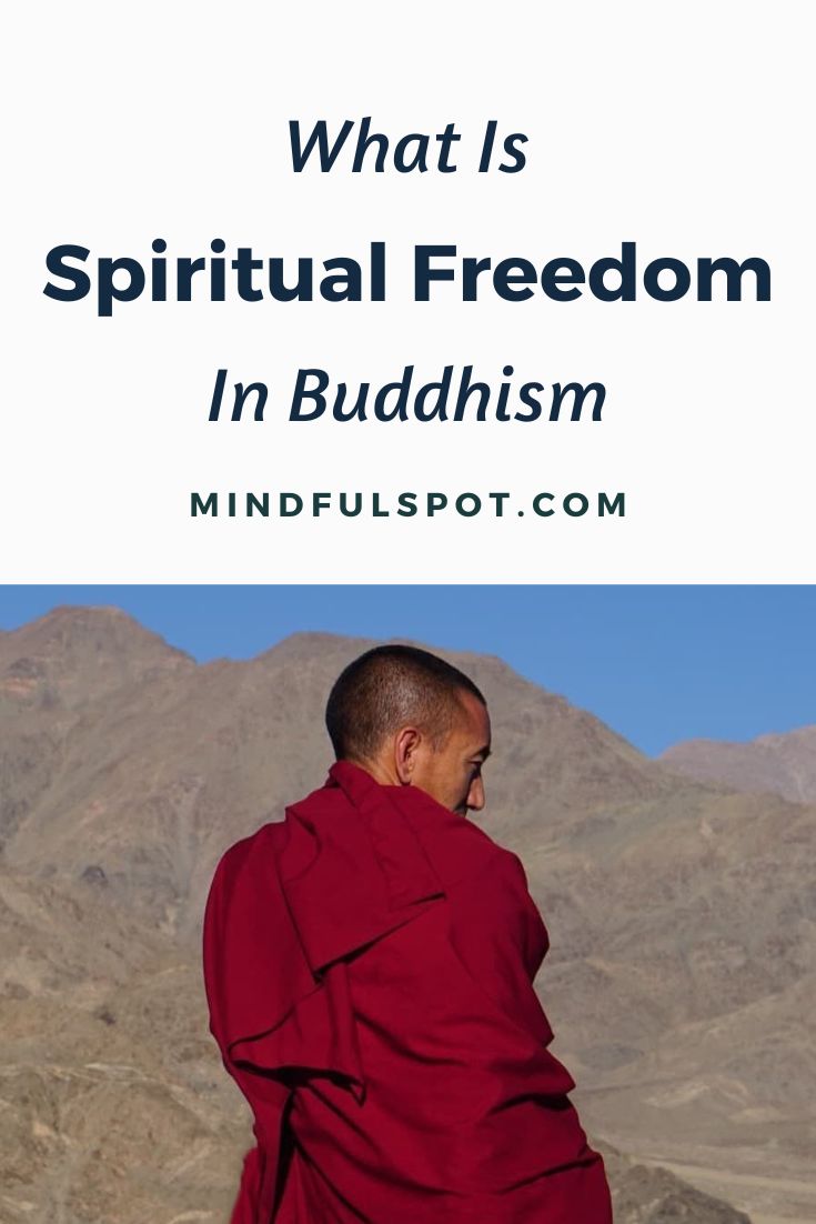Buddhist monk looking at the mountains with text overlay: Learn about the Buddhist concept of spiritual freedom.